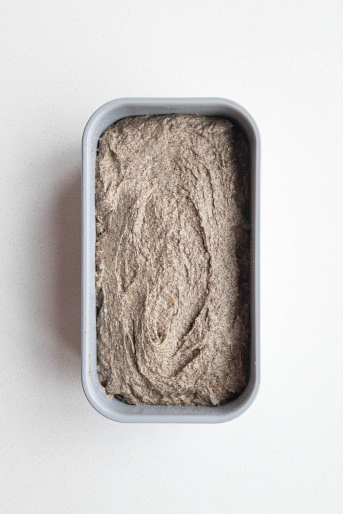 Batter in a loaf pan.