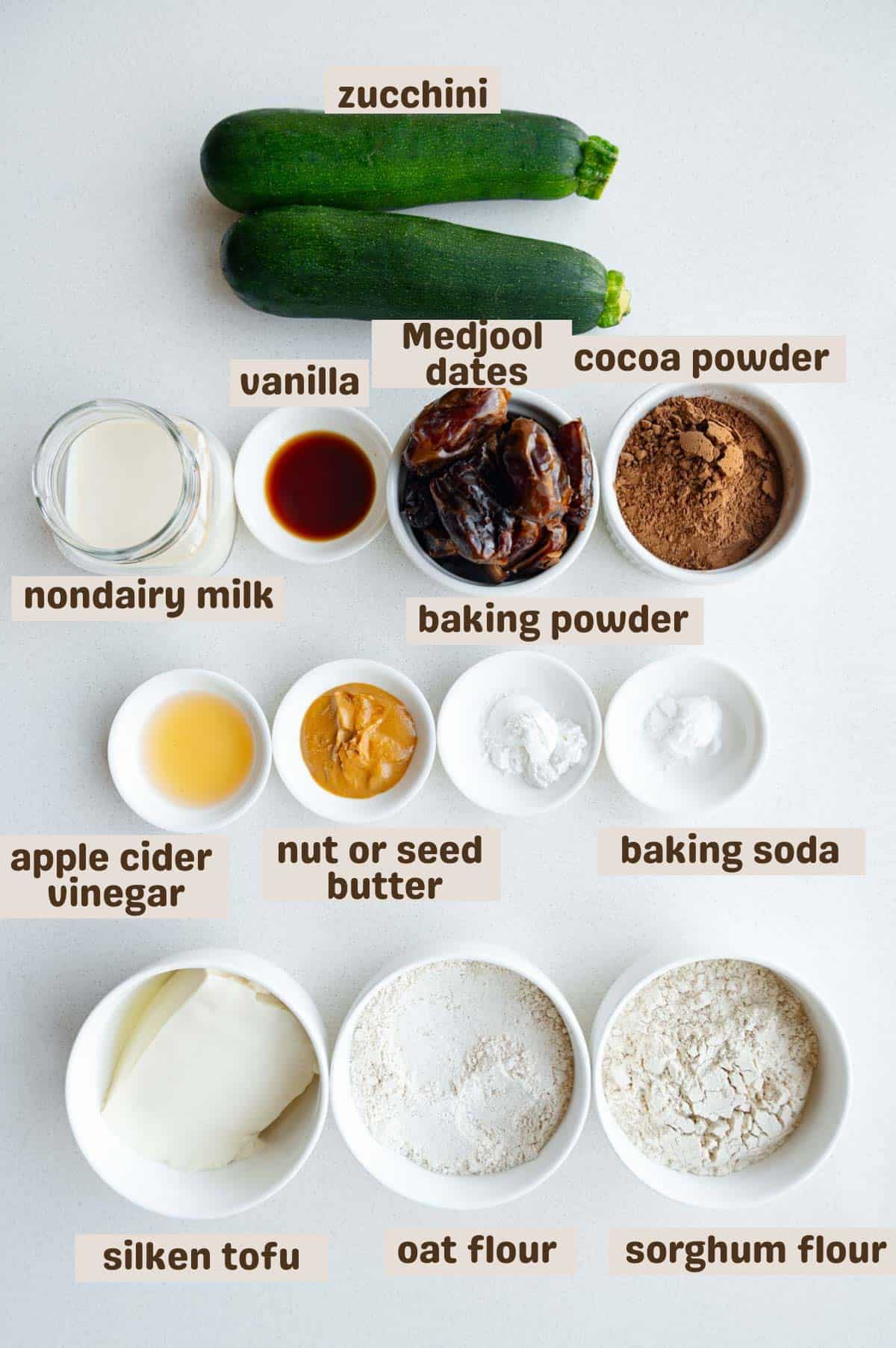 Zucchini, cocoa powder, baking powder, baking soda, oat flour, sorghum flour, silken tofu, nut or seed butter, apple cider vinegar, Medjool dates, nondairy milk, and vanilla extract.