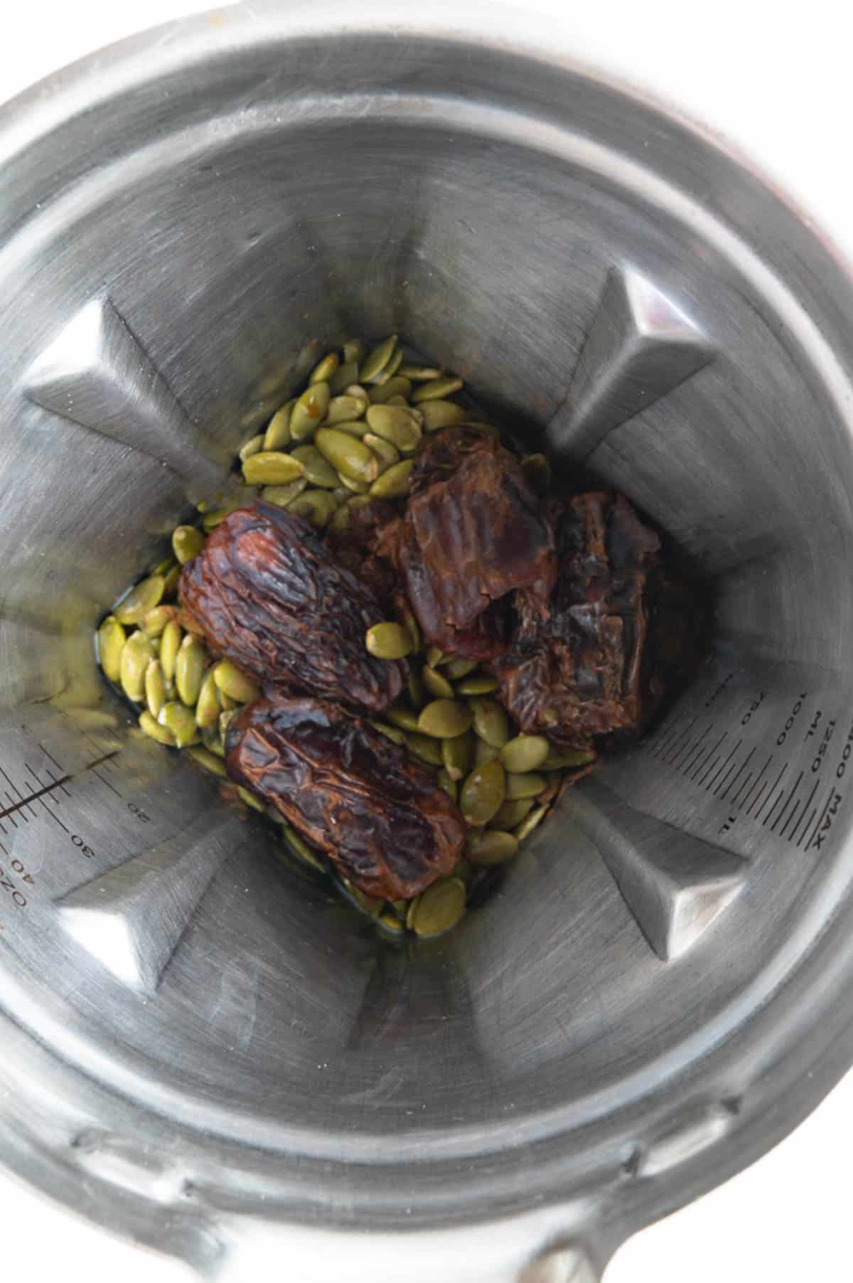 Dates, pumpkin seeds, nondairy milk, vanilla extract, and cinnamon in a blender.
