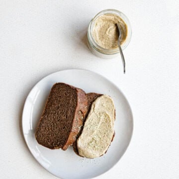 Sweet pumpkin seed butter in a jar and spread onto healthy banana bread.