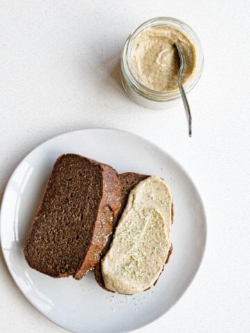 Sweet pumpkin seed butter in a jar and spread onto healthy banana bread.