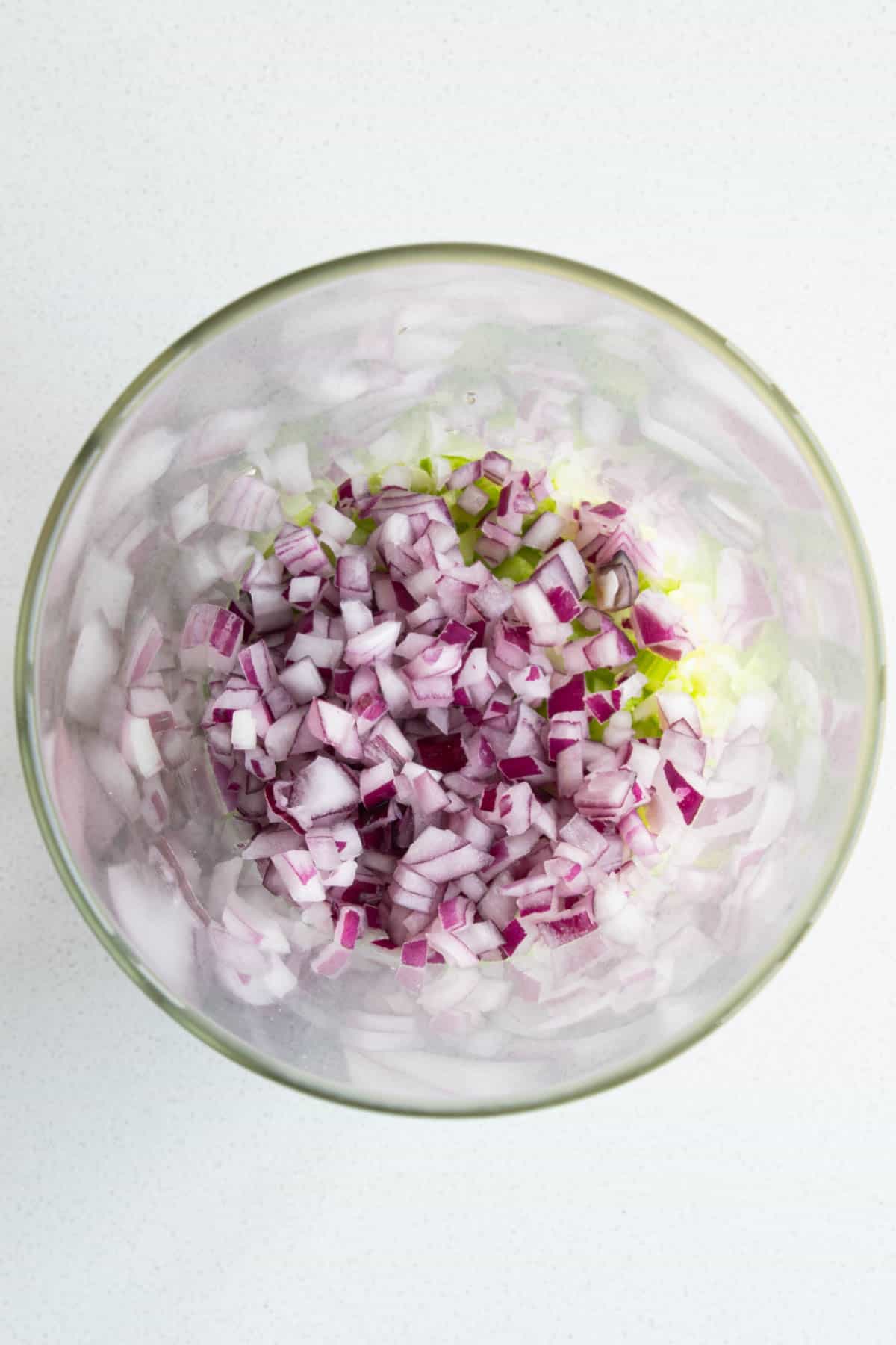 Red onion in a glass salad jar.