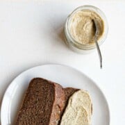 Sweet pumpkin seed butter in a jar and spread onto healthy banana bread.