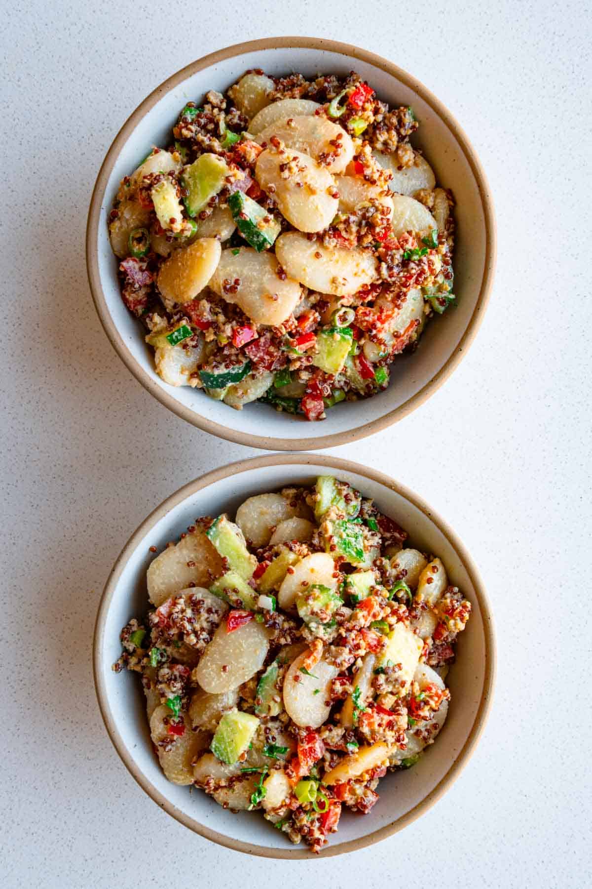 White bean quinoa salad in two bowls.