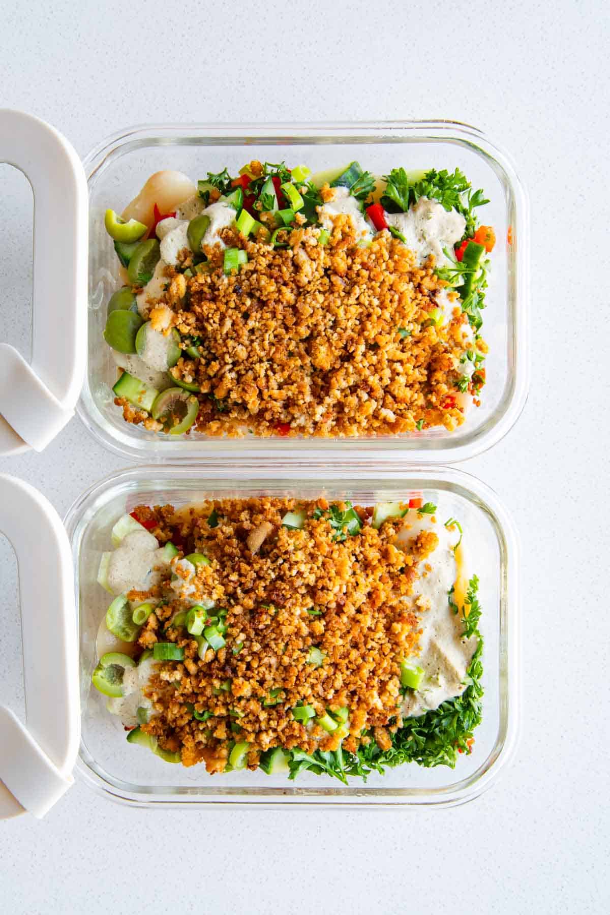 White bean quinoa salad in two meal prep containers.
