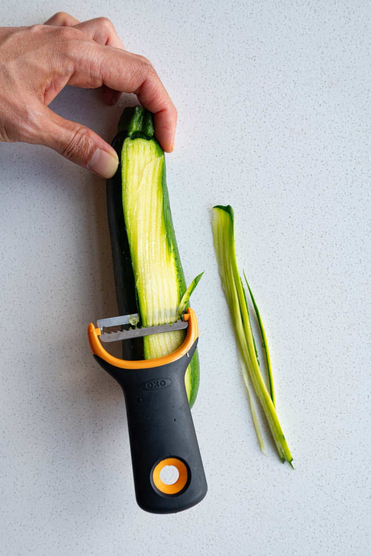 Julienned zucchini using a grater.