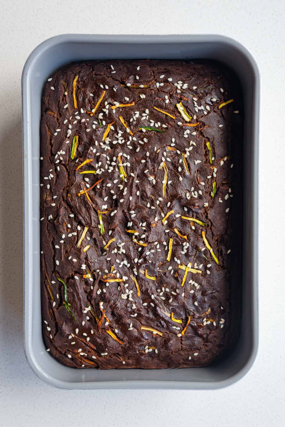 Healthy zucchini chocolate cake in a baking dish.