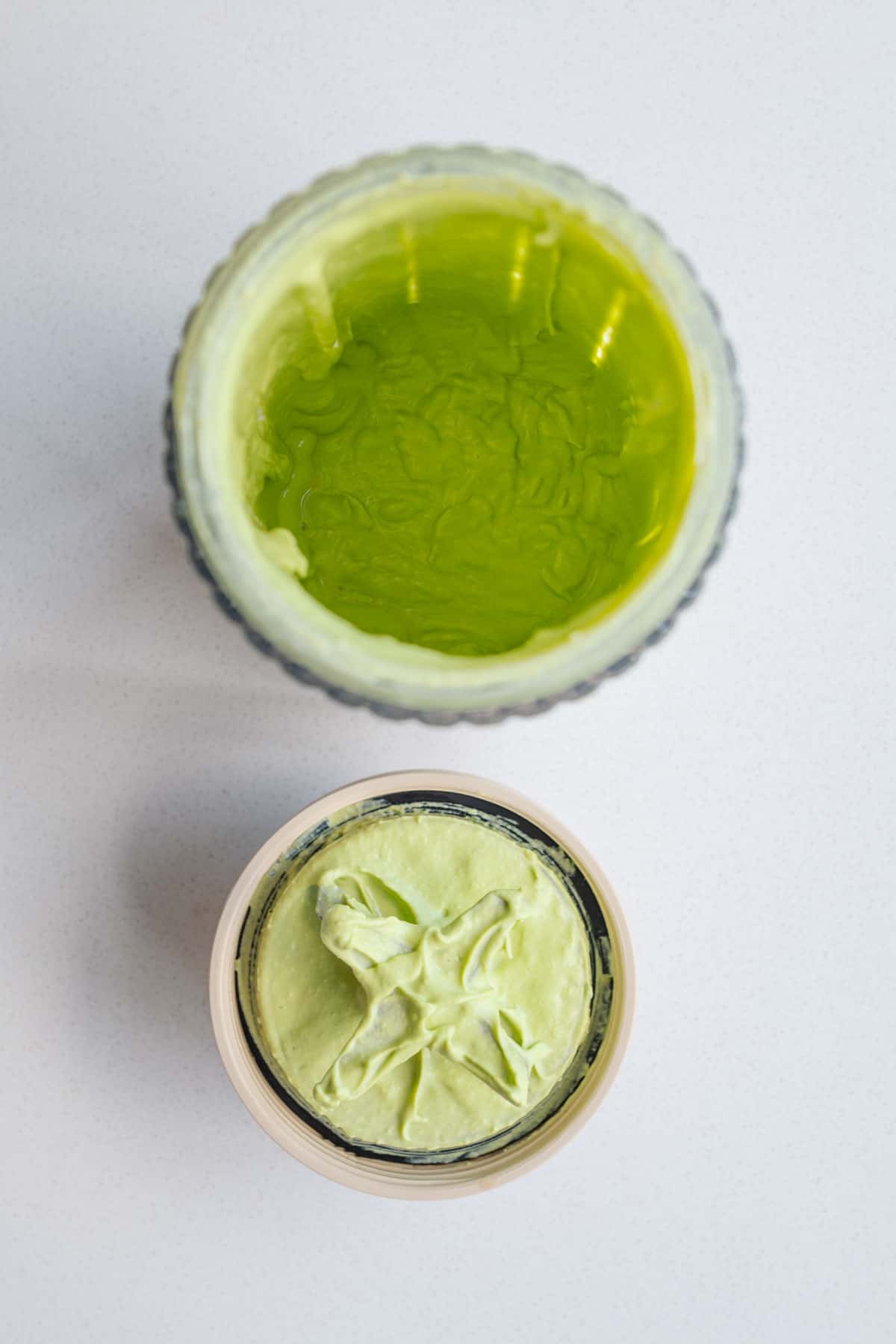Blended vegan ricotta with parsley in a blender.
