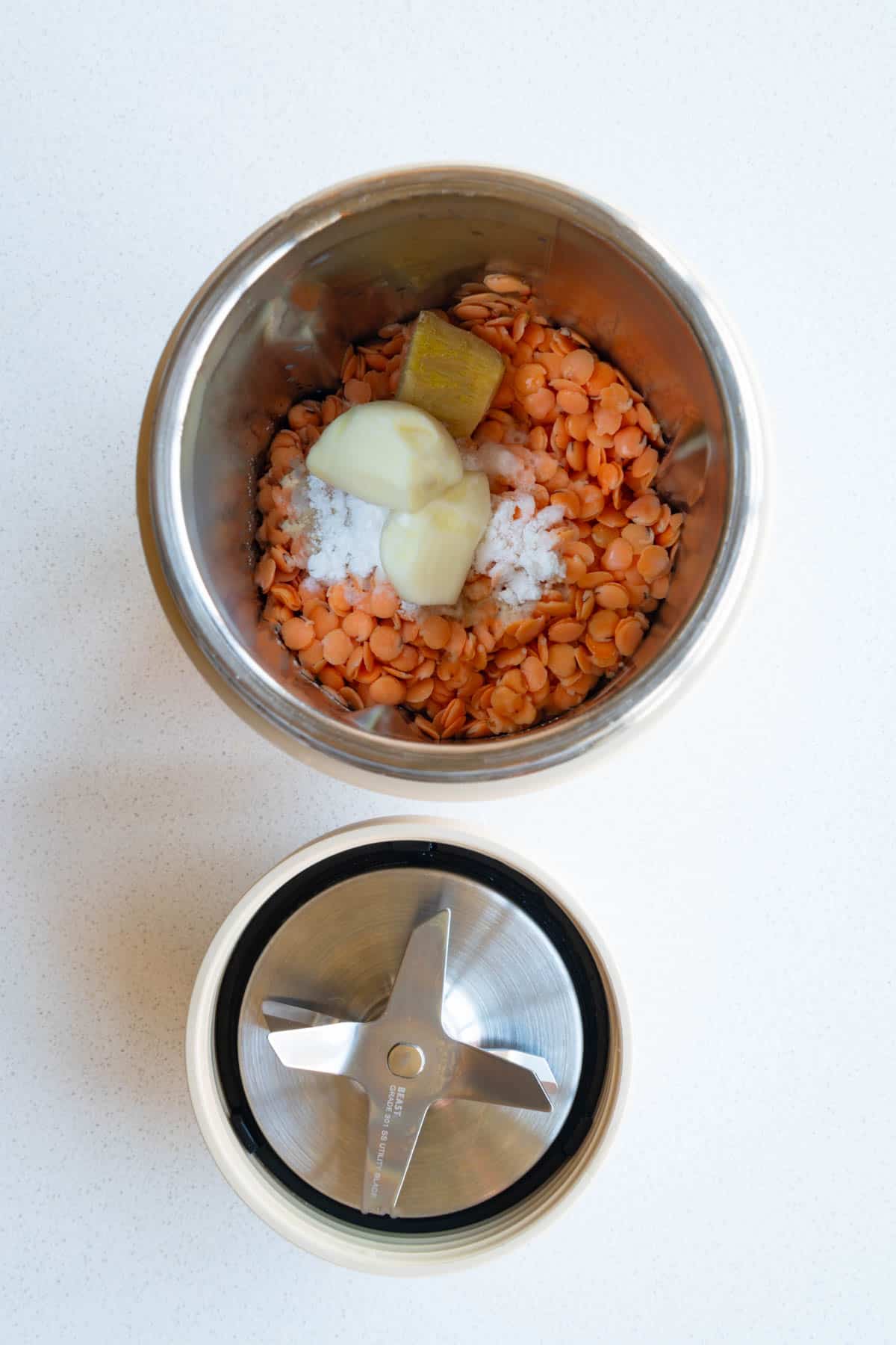 Soaked red lentils, ginger, garlic, baking soda, baking powder, tamari, rice vinegar, and nondairy milk in a blender.