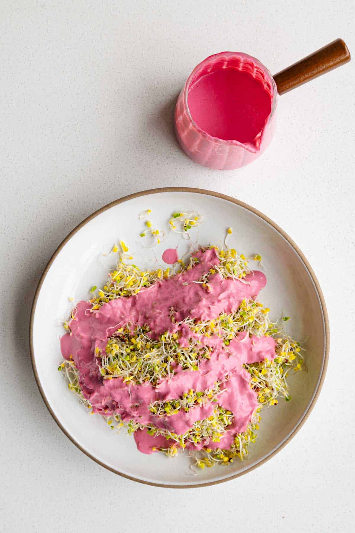 Beet salad dressing and broccoli sprouts.