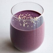 Blueberry cocoa smoothie in a glass.