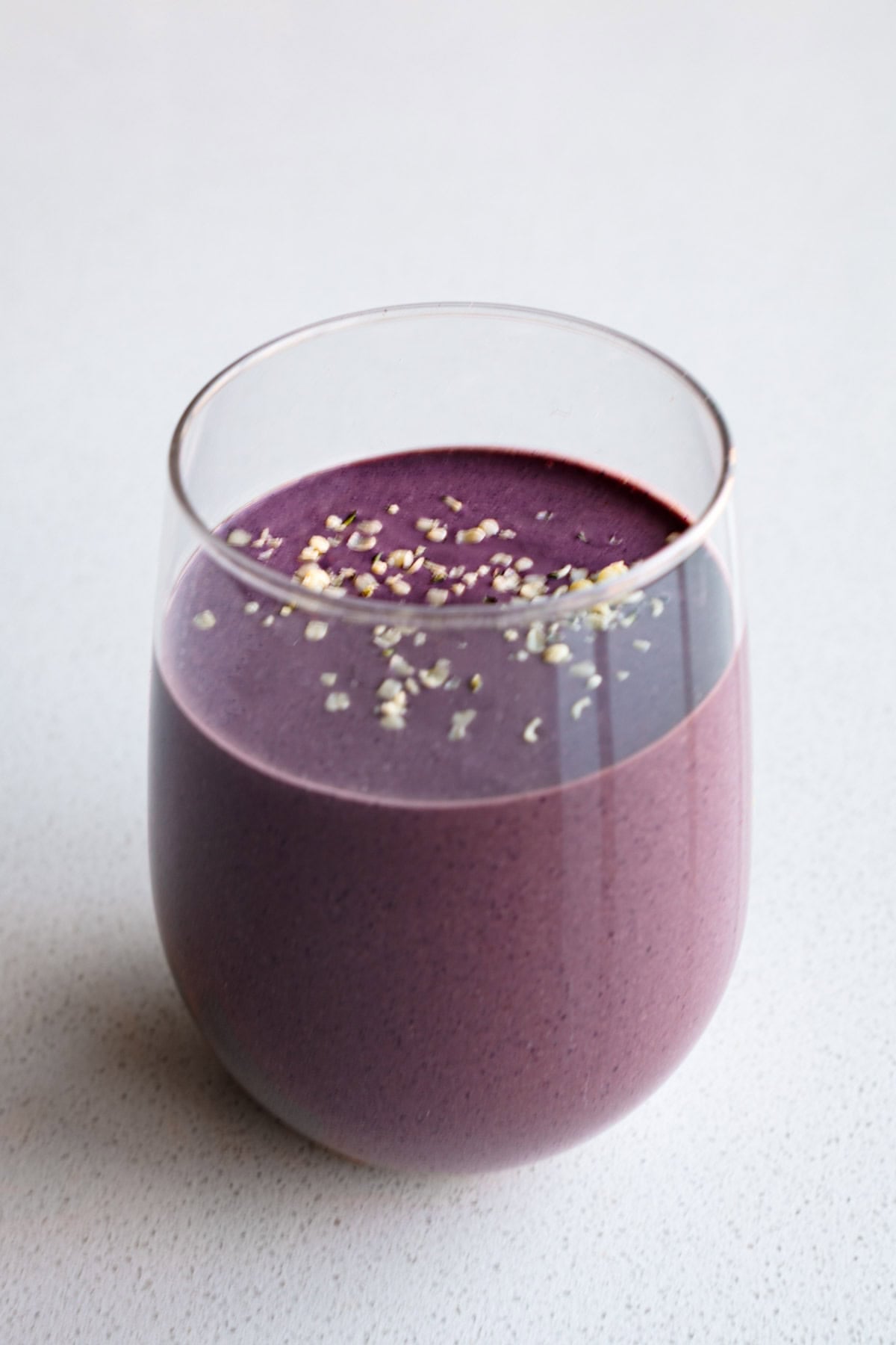 Blueberry cocoa smoothie in a glass.