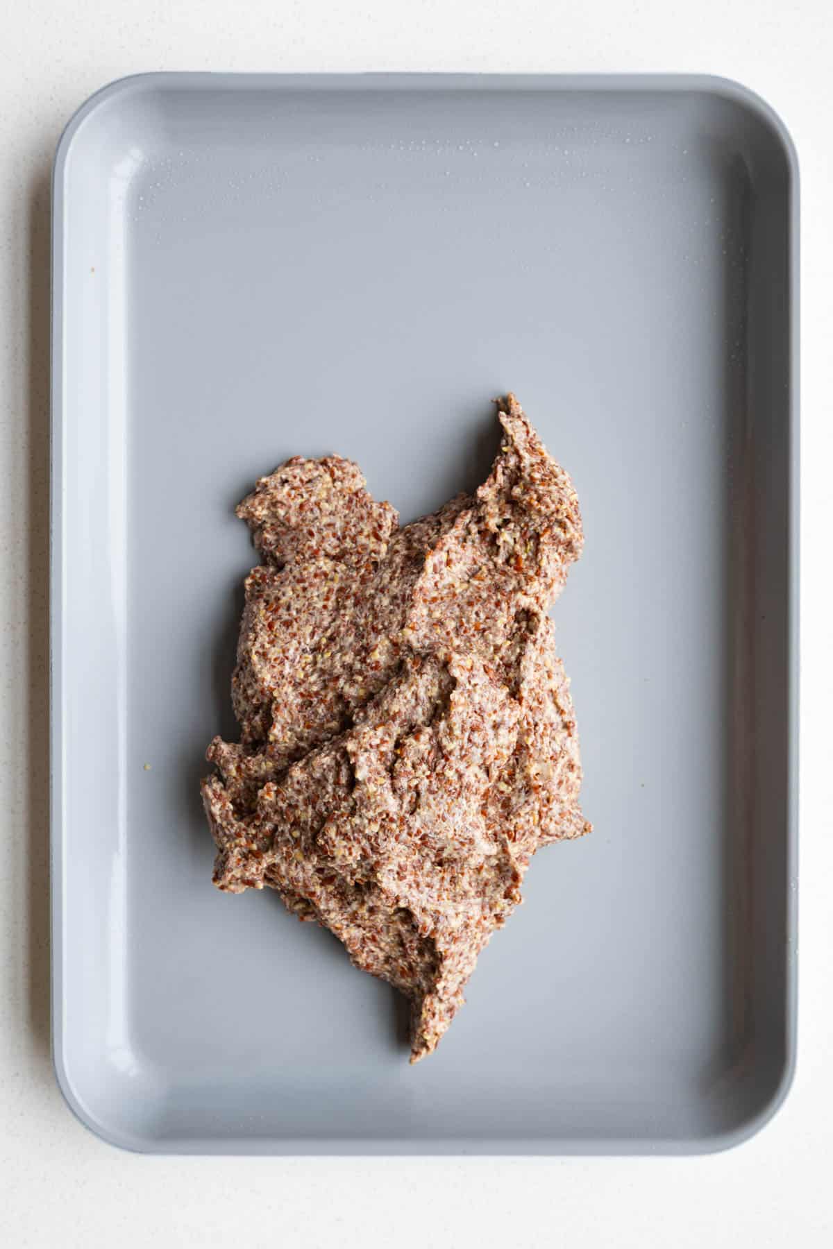 Flax dough on a nonstick baking sheet.