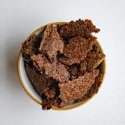 Ground flaxseed crackers in a bowl.