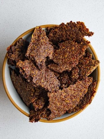 Ground flaxseed crackers in a bowl.