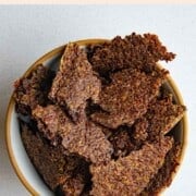 Ground flaxseed crackers in a bowl.