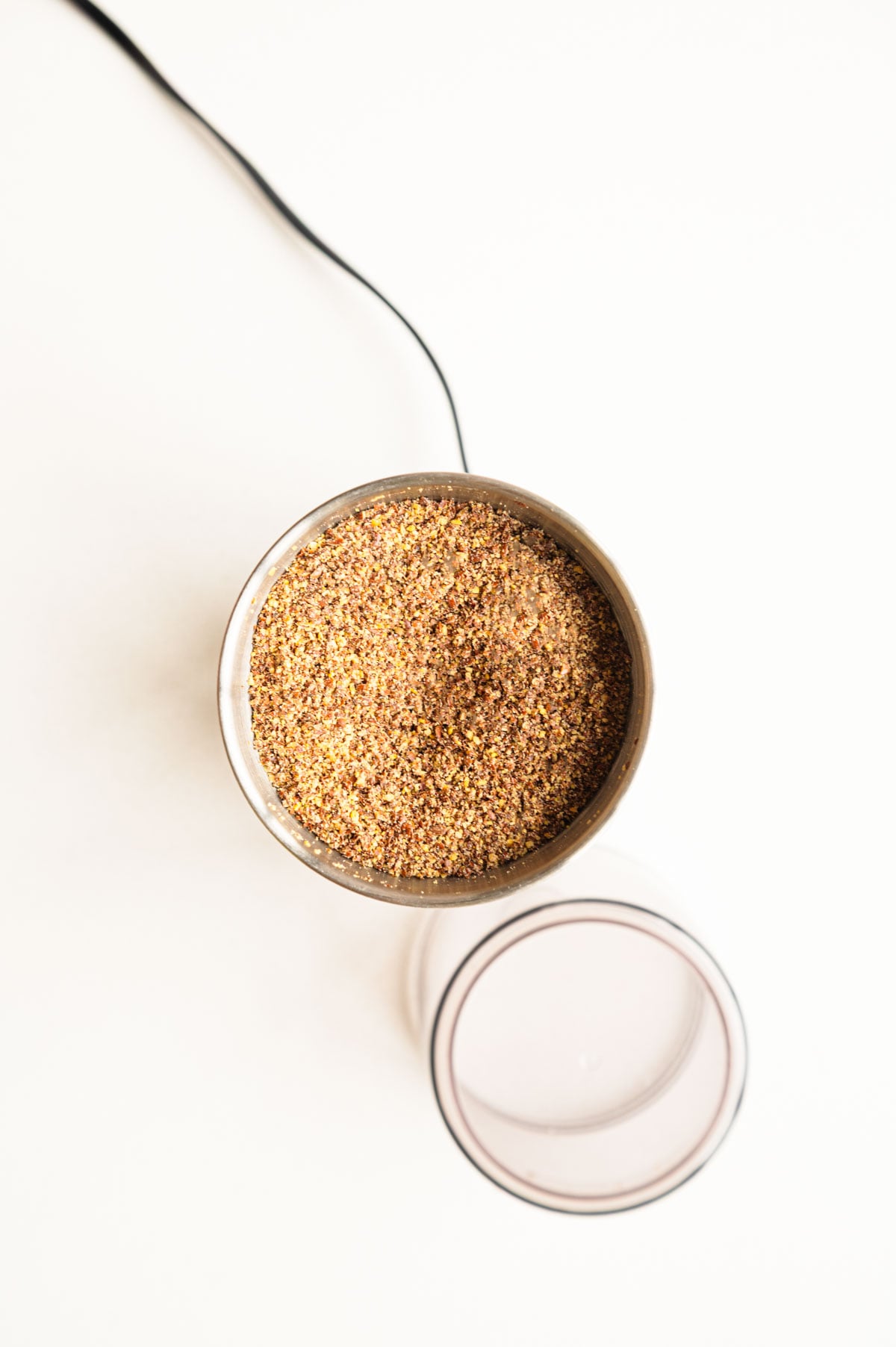Ground flaxseeds in a grinder.