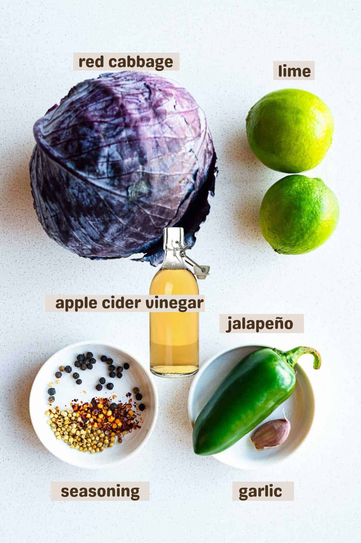 Red cabbage, limes, garlic, coriander seeds, black peppercorns, crushed red pepper, and apple cider vinegar.
