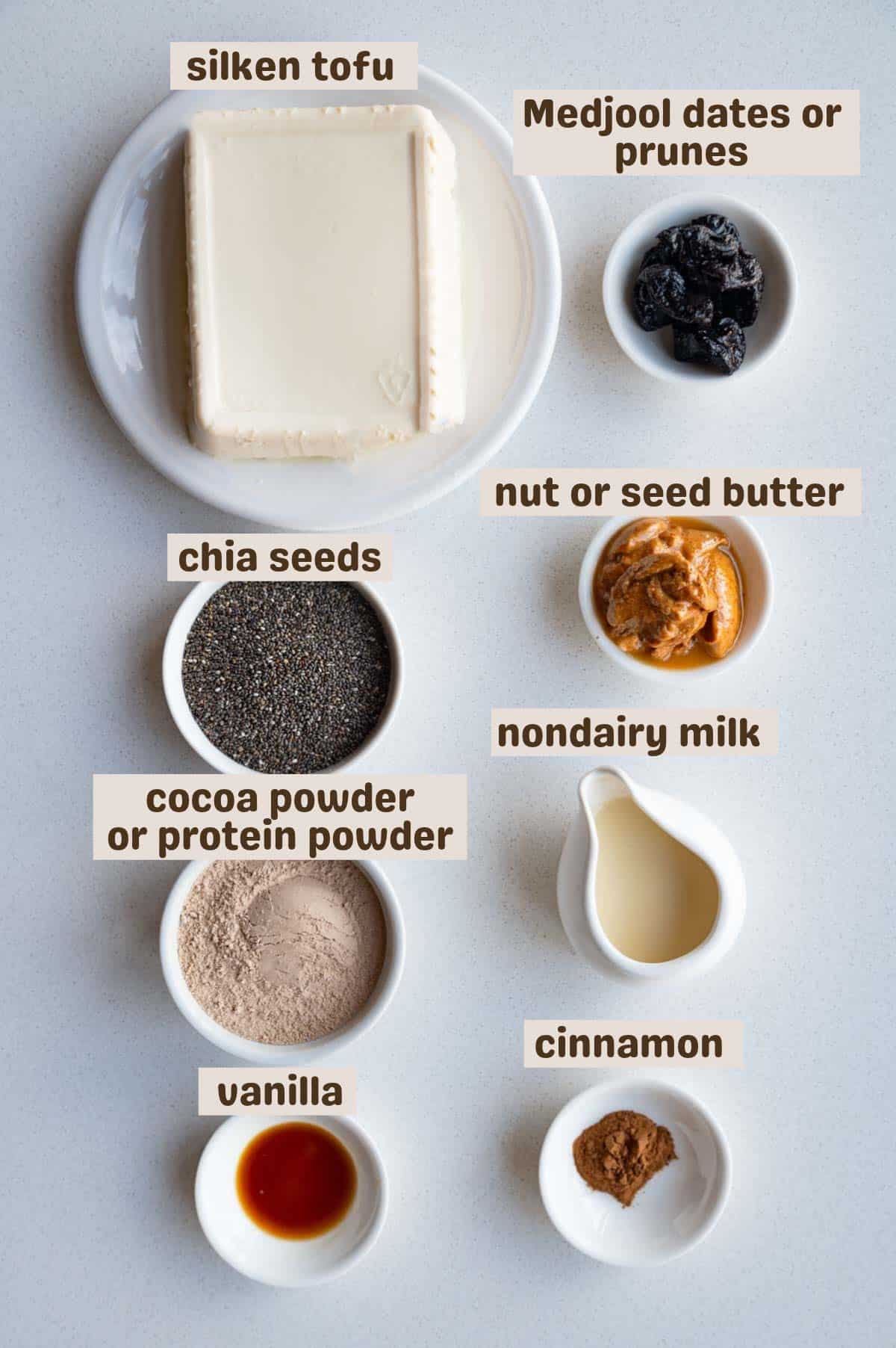 Silken tofu, Medjool dates or prunes, cocoa powder or protein powder, nut or seed butter, nondairy milk, vanilla, and cinnamon.