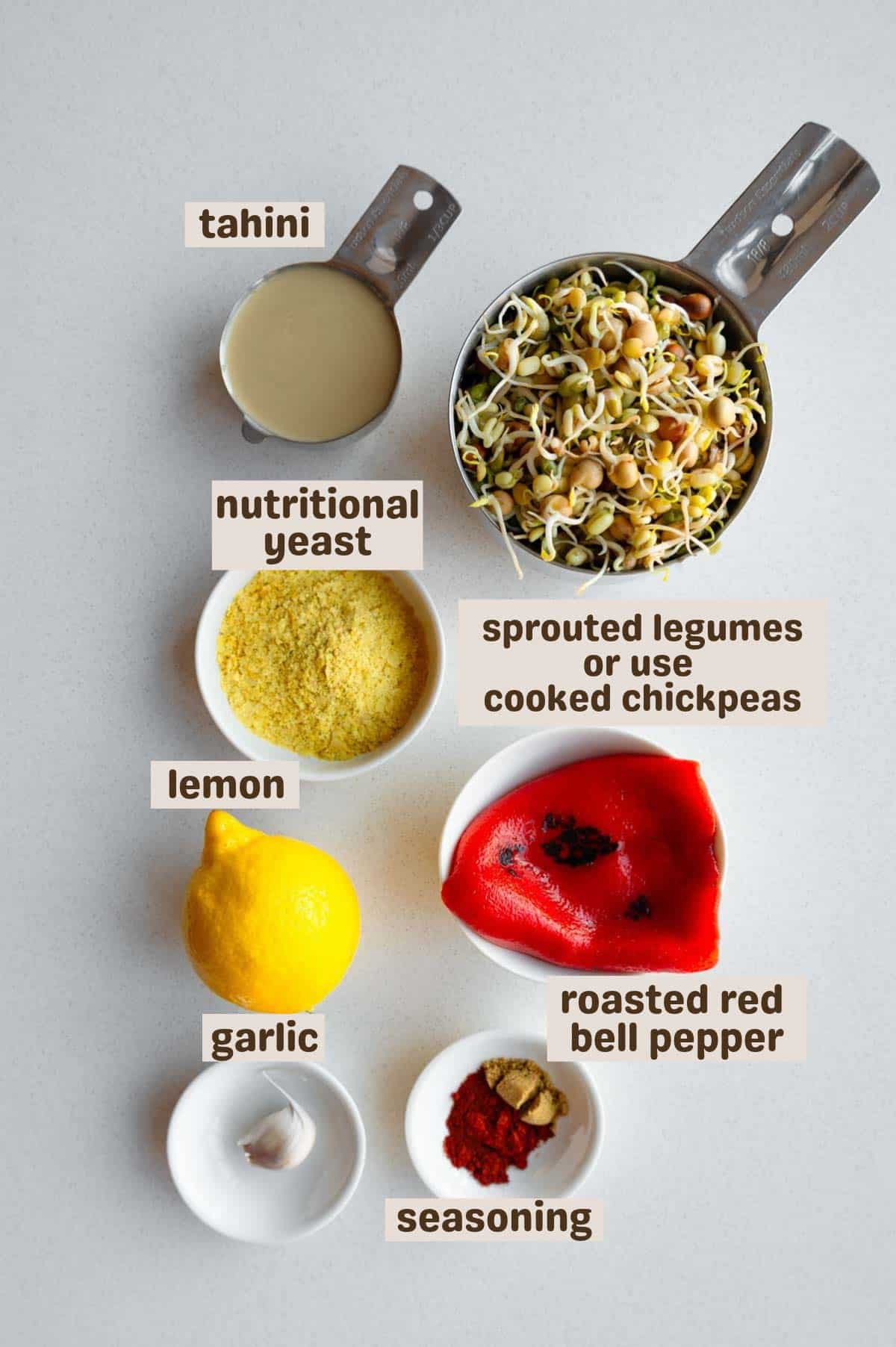 Legume sprouts, tahini, roasted red bell pepper, garlic, lemon, seasoning, and nutritional yeast.