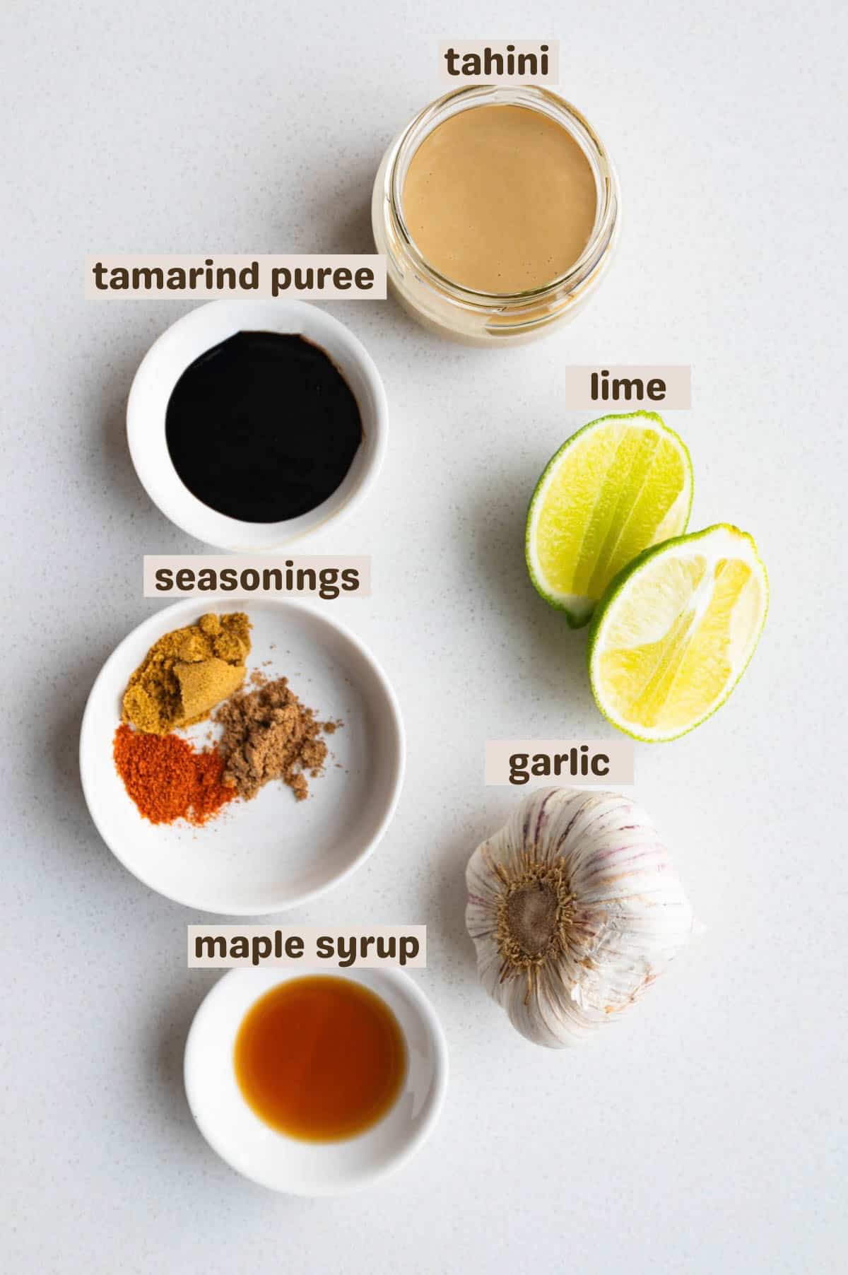 Tahini, tamarind puree, maple syrup, cumin, coriander, cayenne, and lime.