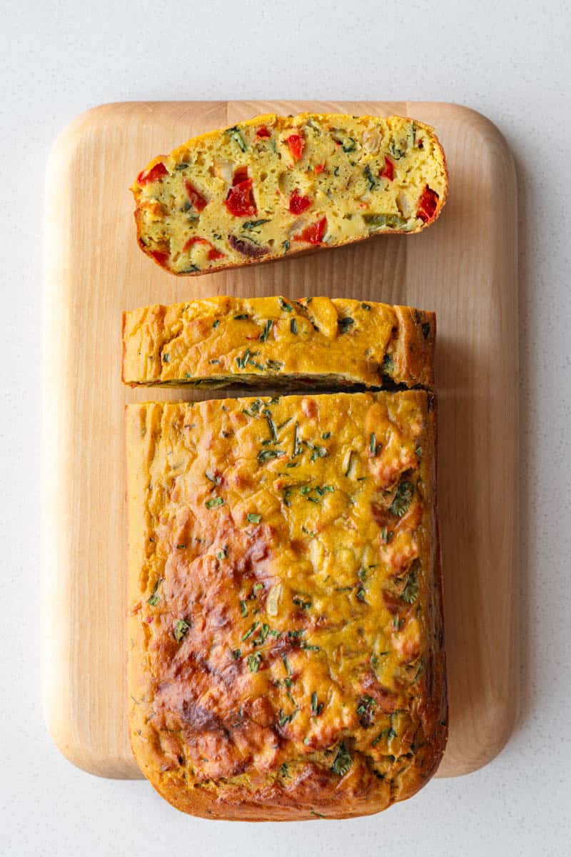 Lentil loaf on a wooden cutting board.