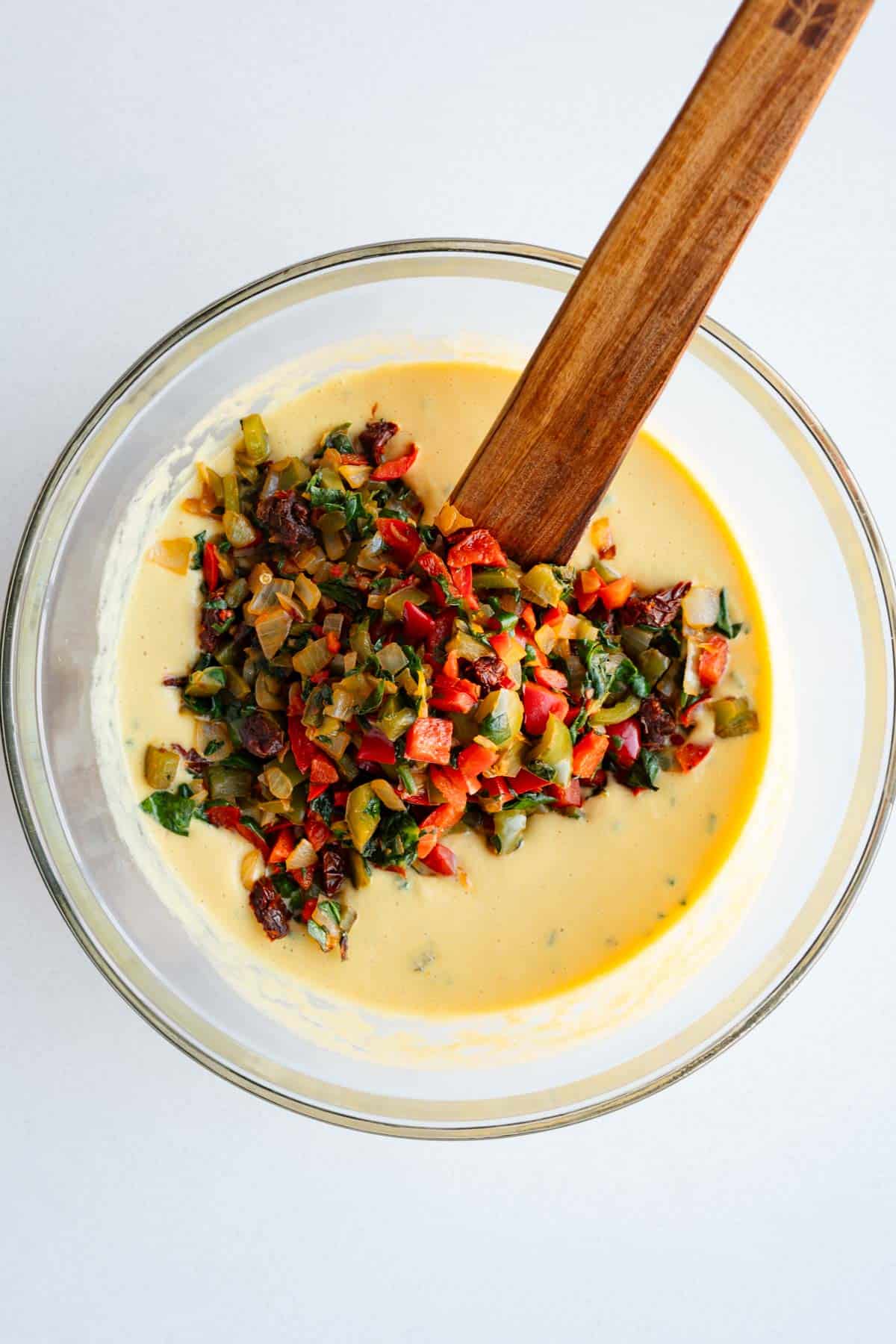 Vegan mung bean egg batter with cooked veggies.