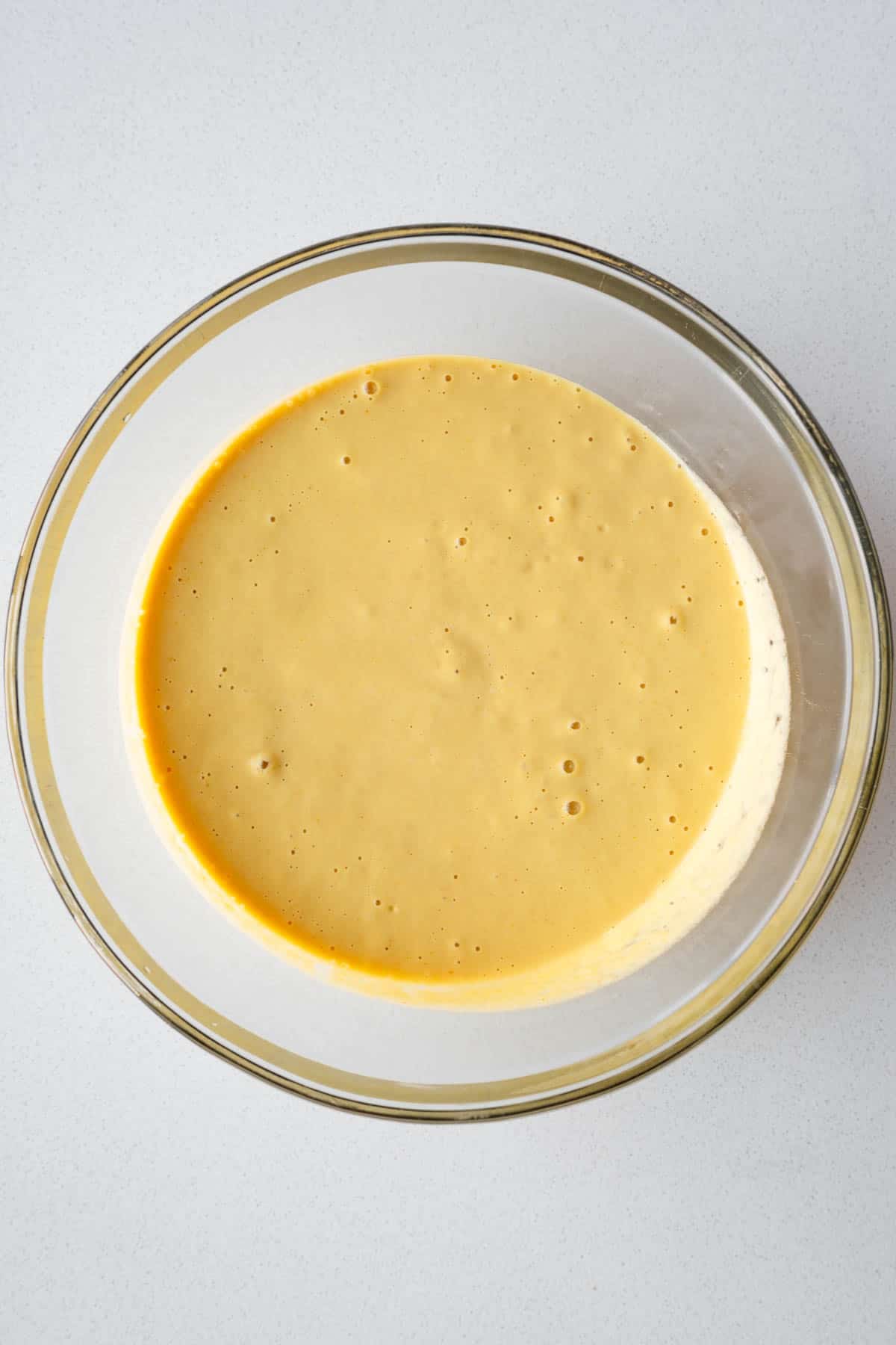Mung bean egg batter in a glass bowl.