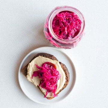 Pickled red cabbage on toasted rye bread with hummus.