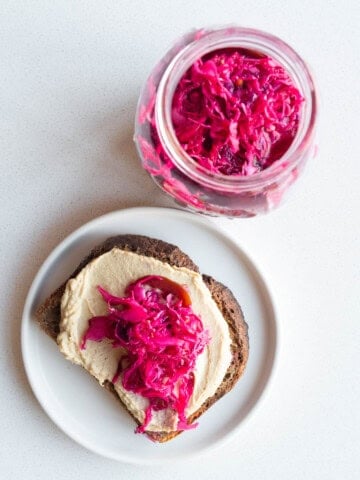 Pickled red cabbage on toasted rye bread with hummus.