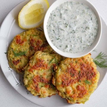 Potato fritters with tzatziki sauce.