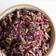 Red cabbage lentil crunch salad in a wooden bowl.