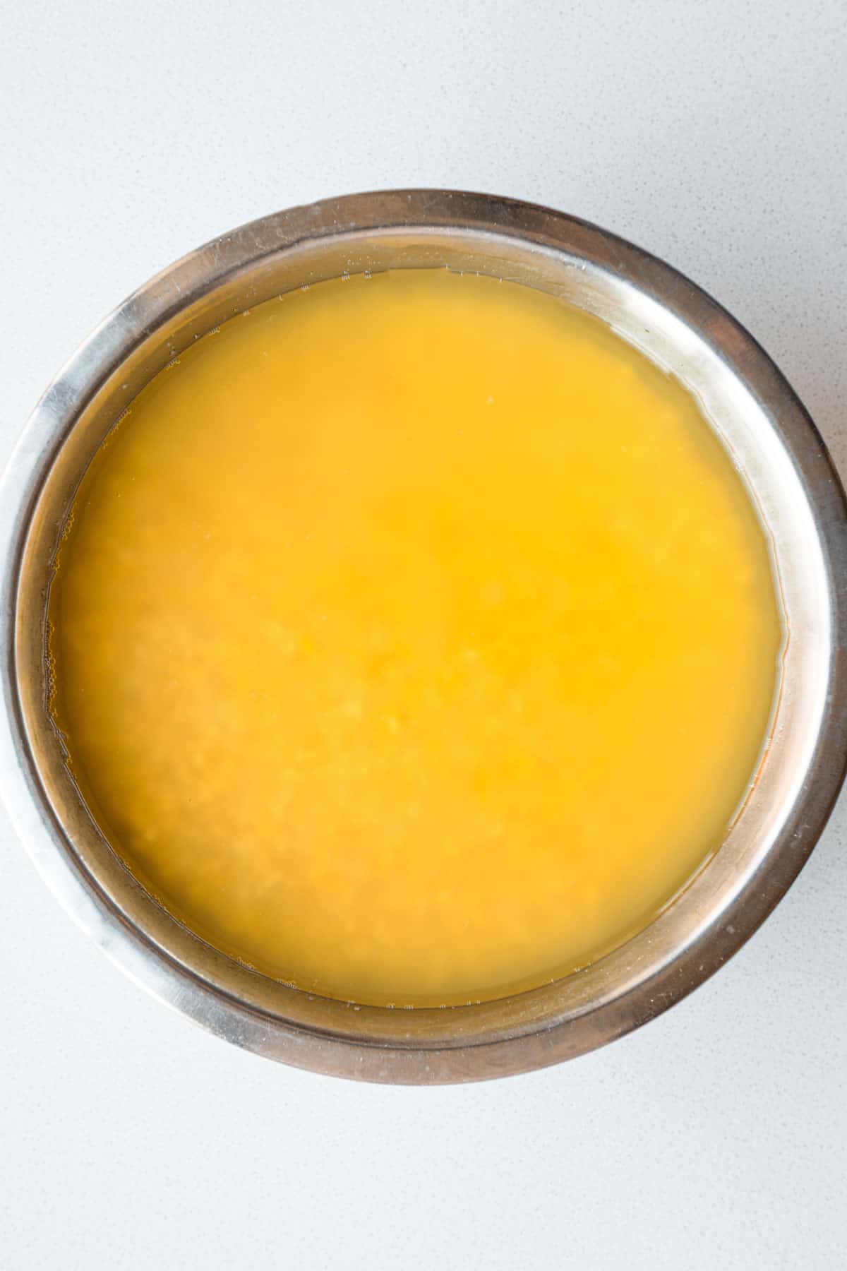 Mung beans or moong dal soaking in a bowl.