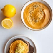 Bell pepper sprouted hummus on pumpernickel toast.