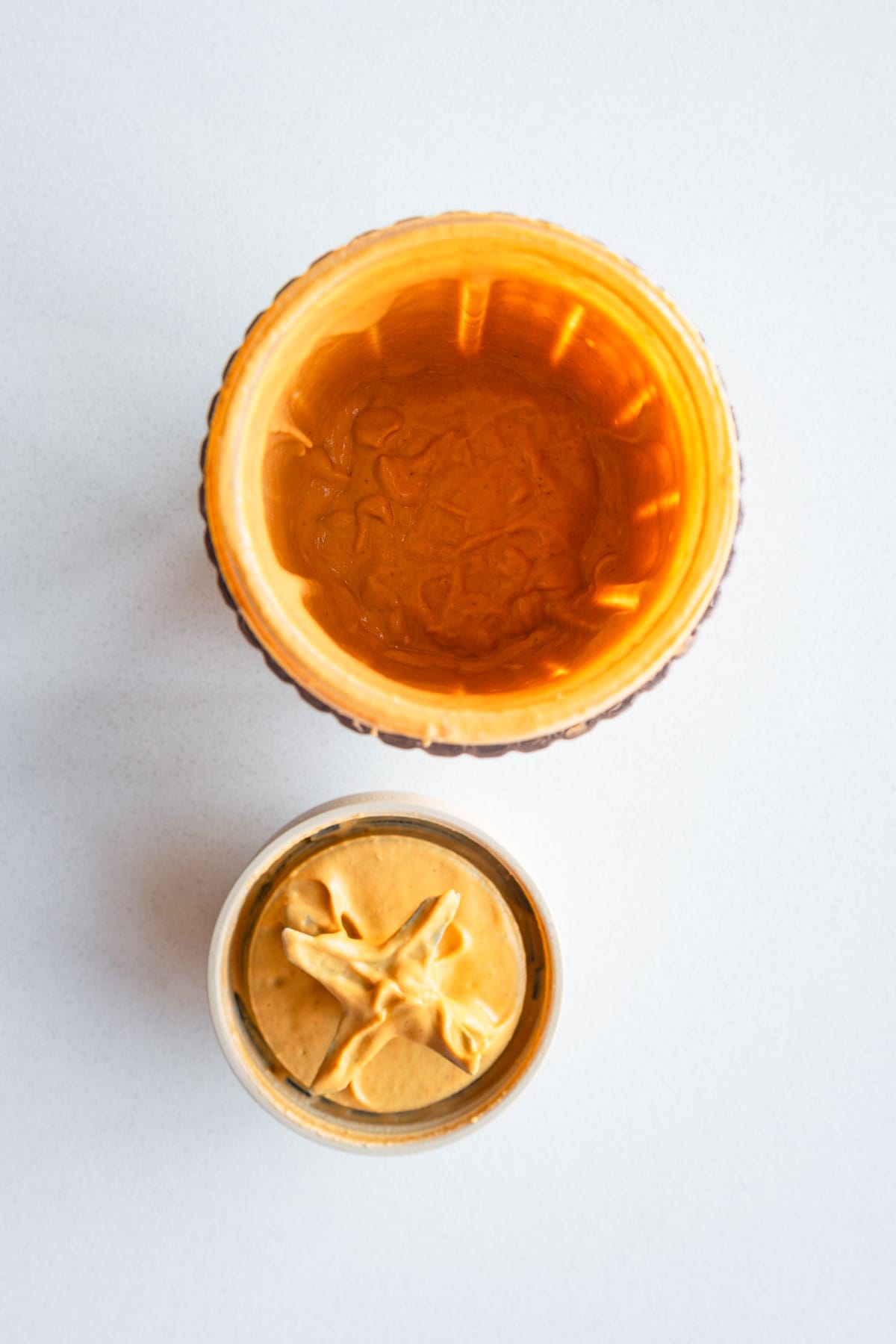 Blended bell pepper humus in a canister.
