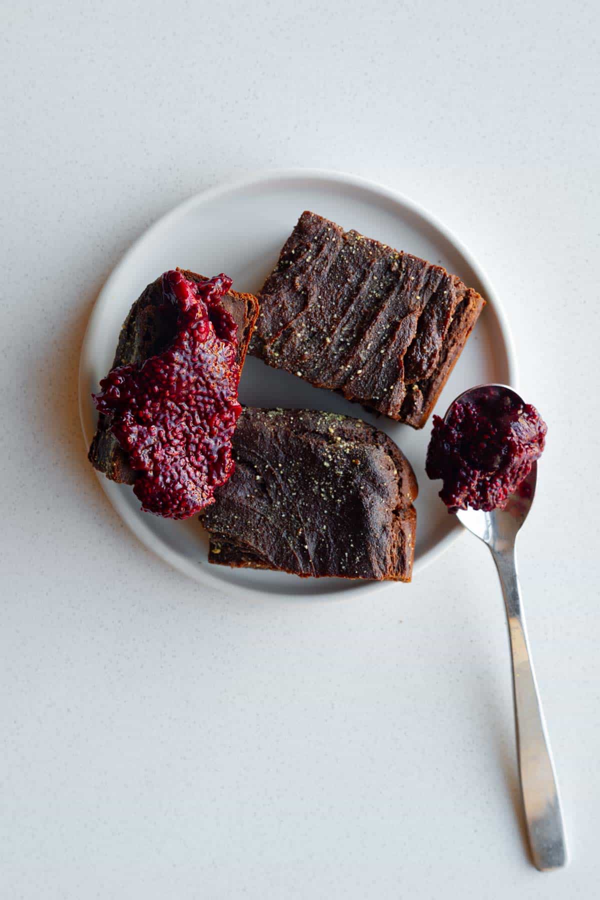 Vegan Banana Bread Tofu Brownies on a white plate with chia jam.
