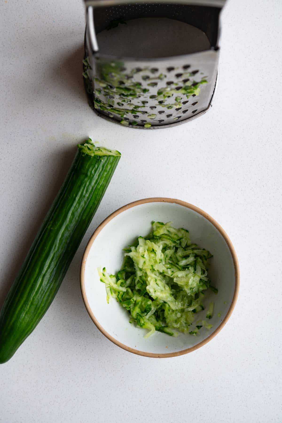 Grated cucumber with a box grater.