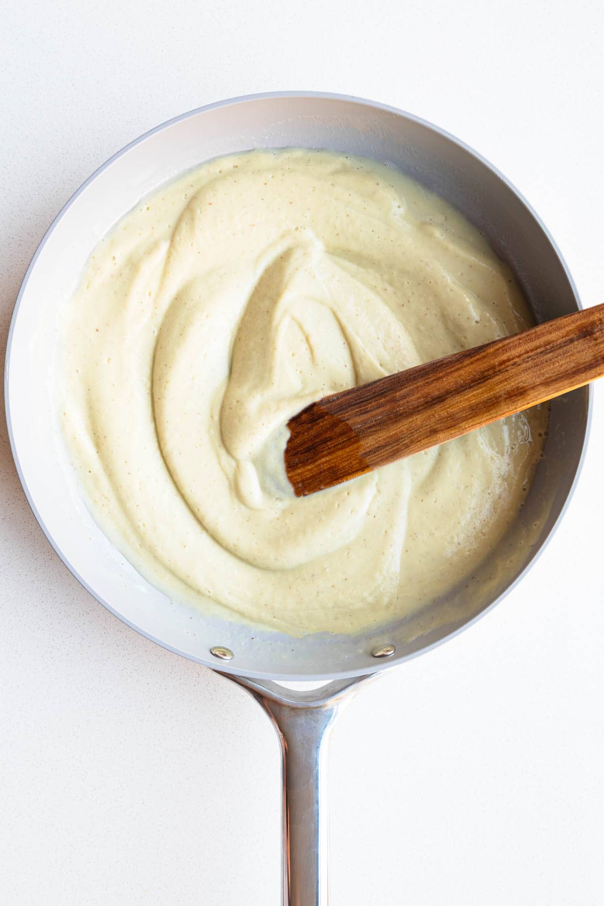 Cauliflower cream sauce in a skillet.